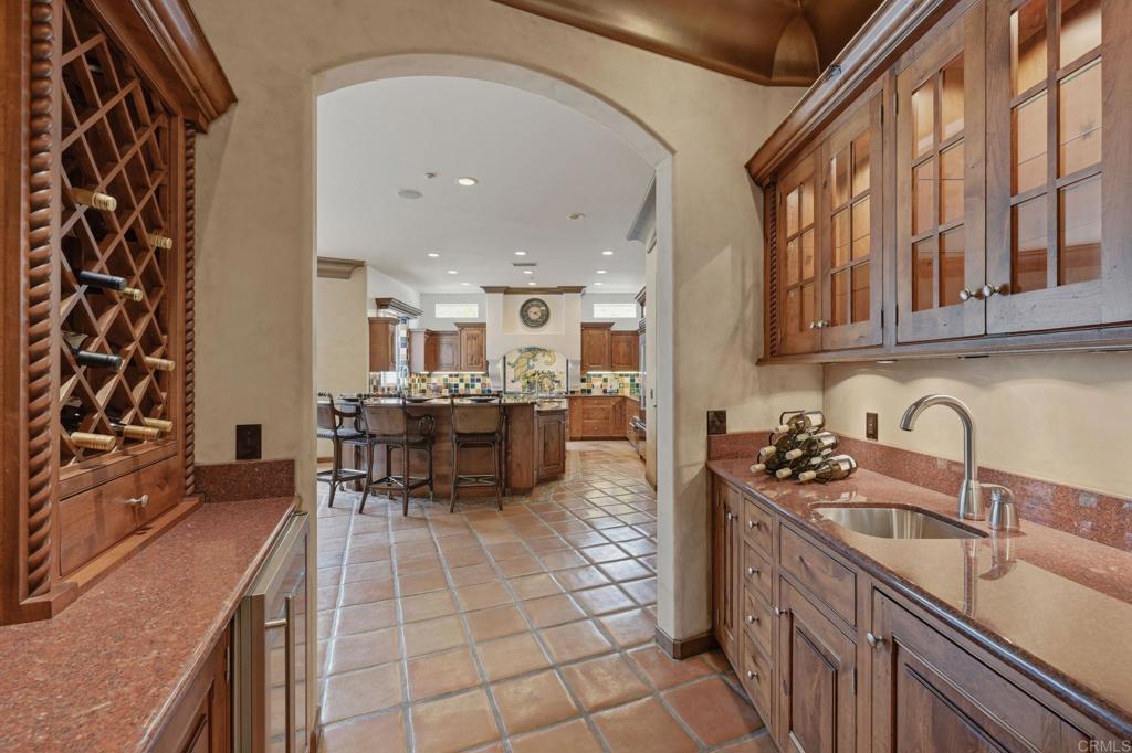 3244 Olivenhain Farms Road Encinitas, CA 92024 - Photo 17 of 47 a kitchen with stainless steel appliances granite countertop a stove a sink and a microwave