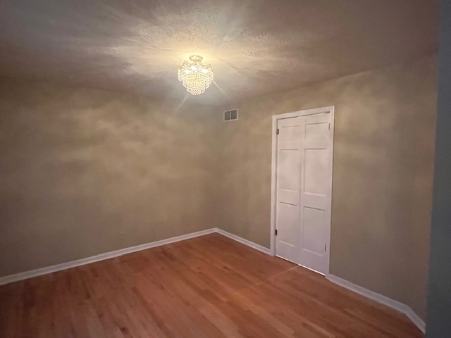 1210 Sunset Terrace Rochelle, IL 61068 - Photo 3 of 38 an empty room with wooden floor and windows