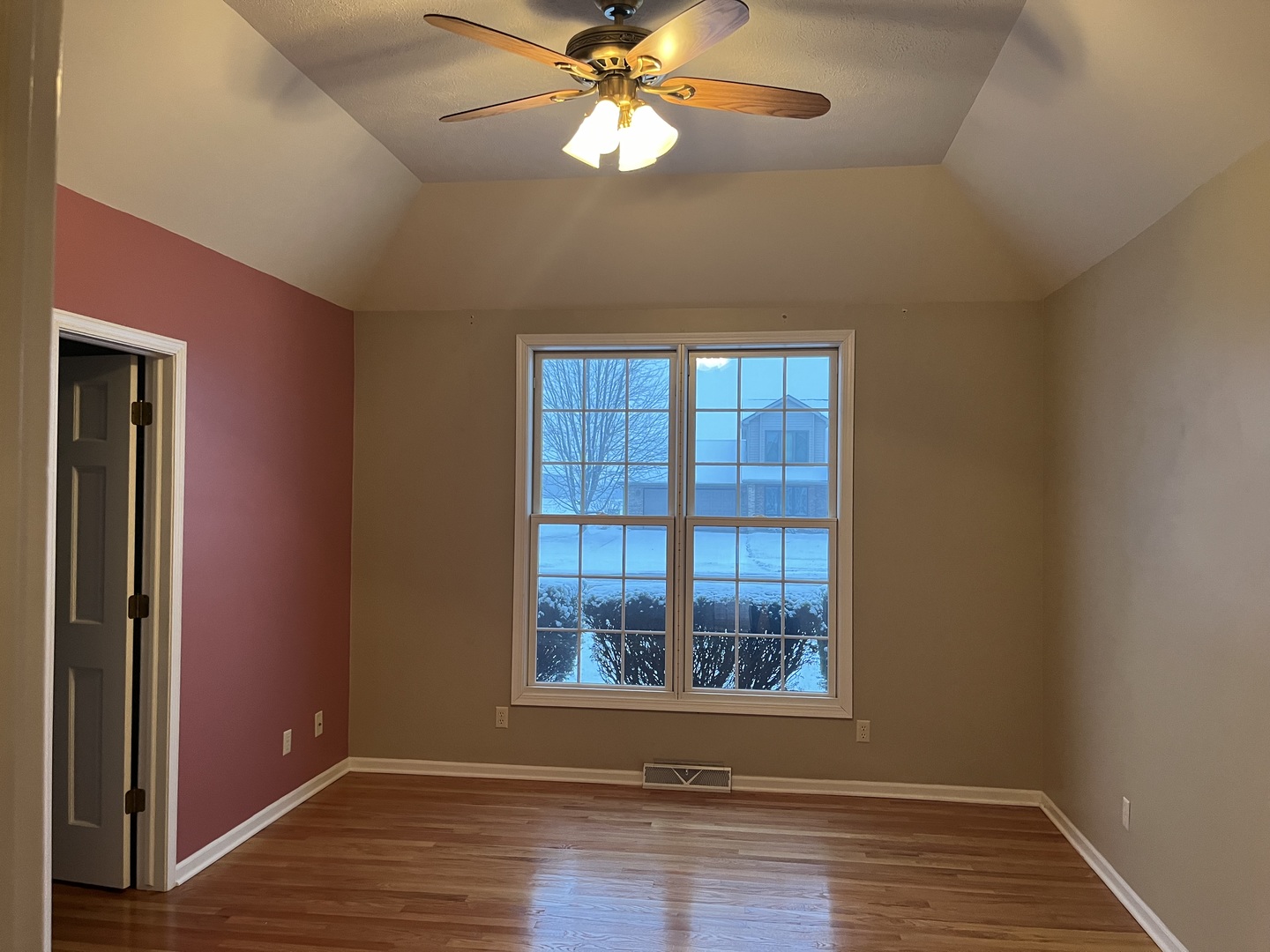1210 Sunset Terrace Rochelle, IL 61068 - Photo 10 of 38 a view of an empty room with wooden floor and a window