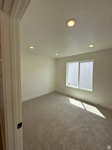 1225 West 500 South Logan, UT 84321 - Photo 30 of 39 Room featuring light-colored carpeting, white walls, and recessed lighting fixtures
