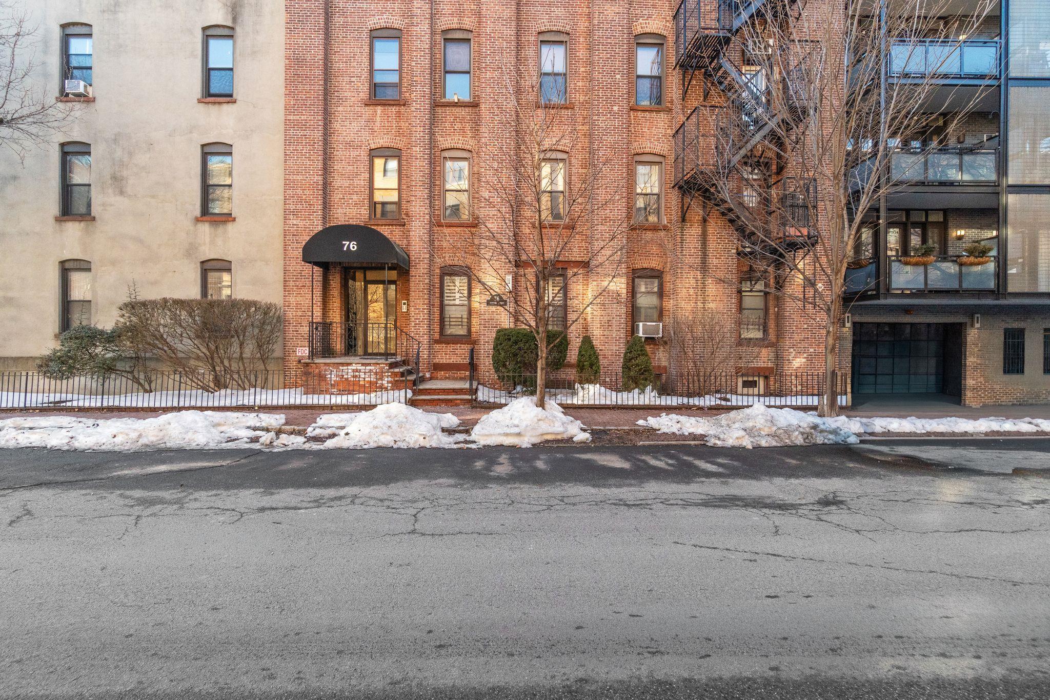 76 Jackson Street, Unit 4R Hoboken, NJ 07030 - Photo 15 of 17 a view of a brick building next to a road
