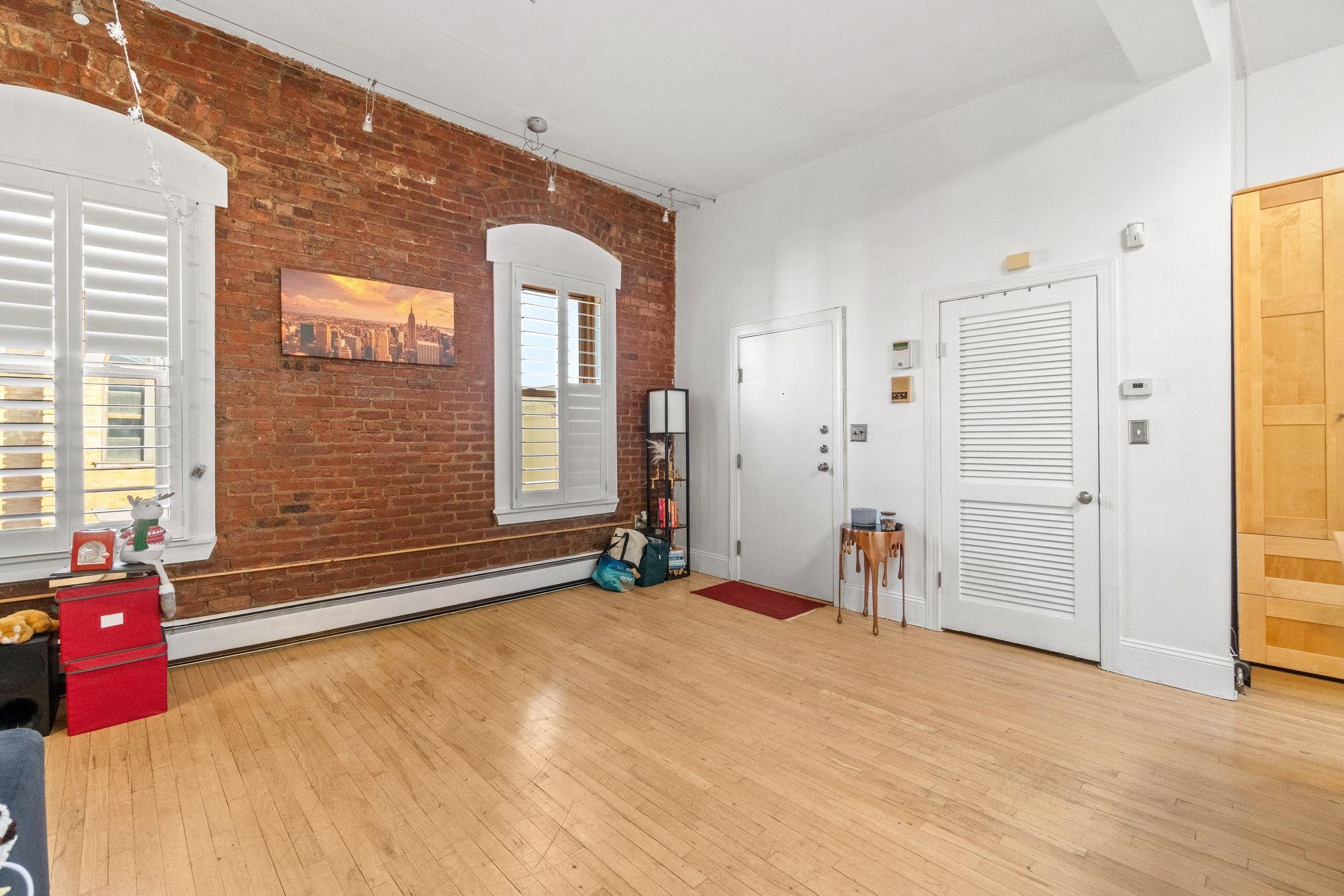 76 Jackson Street, Unit 4R Hoboken, NJ 07030 - Photo 3 of 17 a view of a livingroom with furniture
