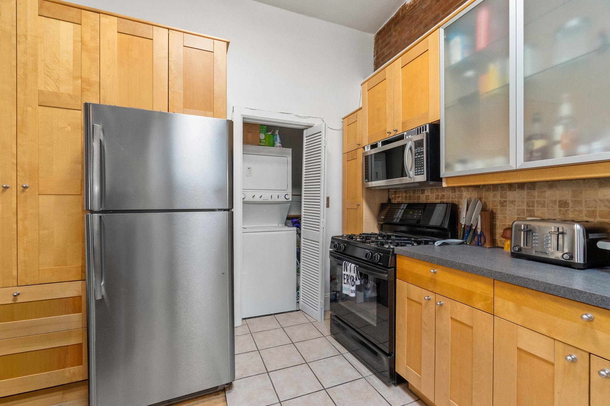 76 Jackson Street, Unit 4R Hoboken, NJ 07030 - Photo 8 of 17 a kitchen with stainless steel appliances granite countertop a refrigerator a oven and a more cabinets