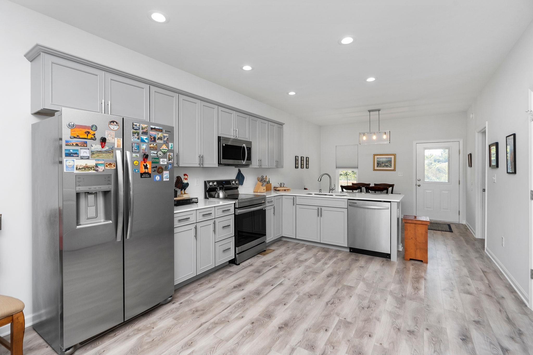 138 Garber Street Staunton, VA 24401 - Photo 15 of 47 a kitchen with a refrigerator cabinets and wooden floor