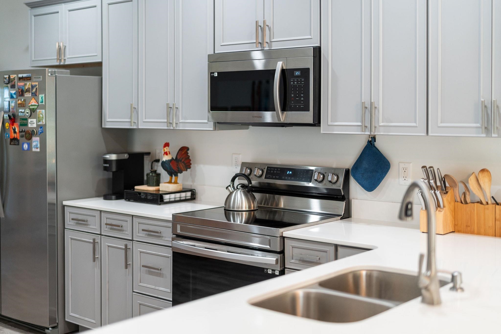 138 Garber Street Staunton, VA 24401 - Photo 19 of 47 a kitchen with stainless steel appliances granite countertop a sink and a microwave