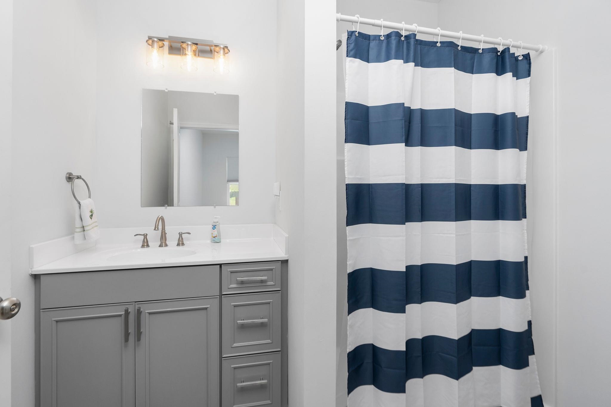 138 Garber Street Staunton, VA 24401 - Photo 30 of 47 a bathroom with a sink and a mirror