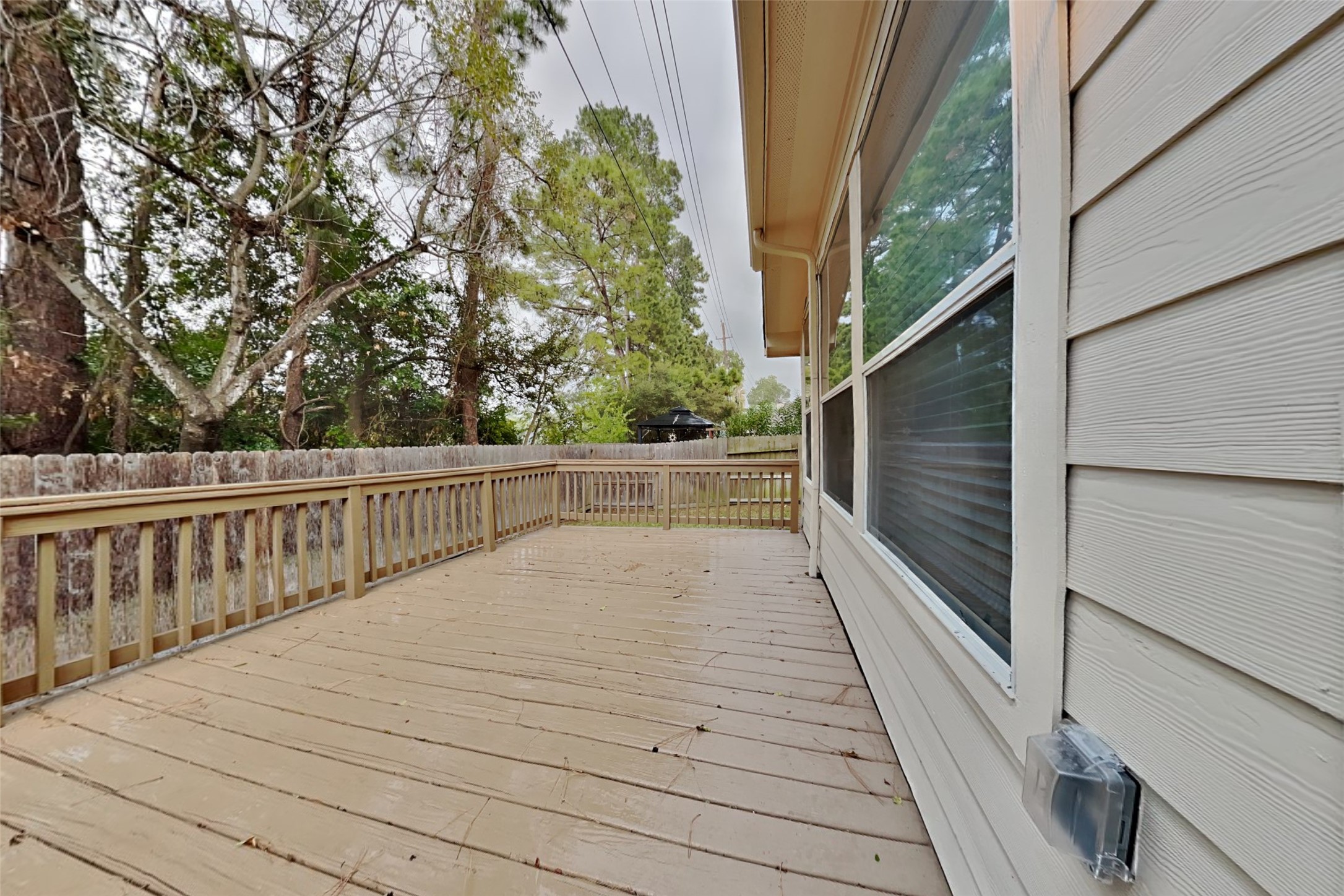 18730 Dempsey Oaks Drive Humble, TX 77346 - Photo 16 of 18 a balcony with view of trees in front of it