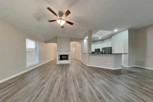a view of kitchen with cabinets and wooden floor