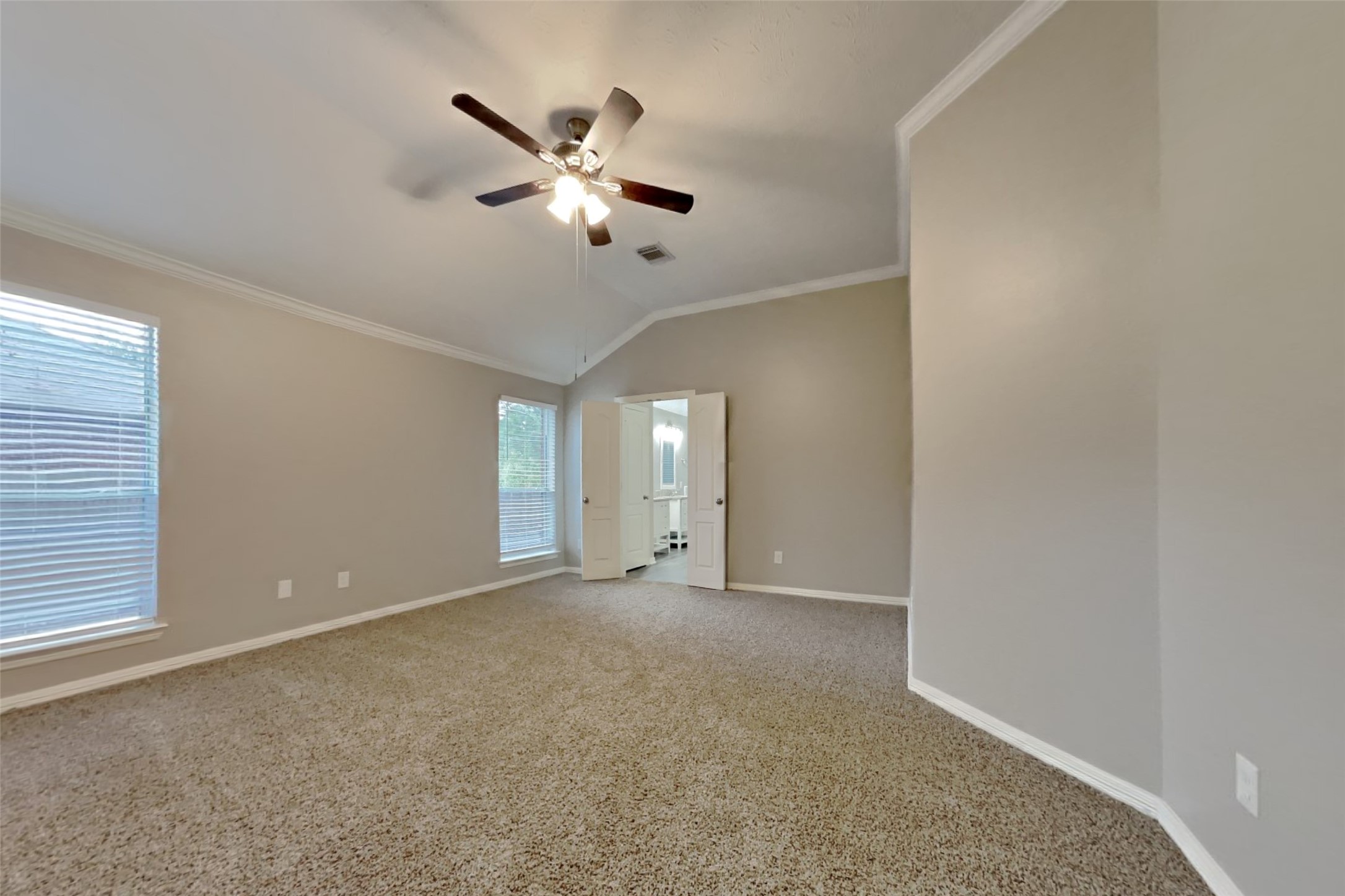 18730 Dempsey Oaks Drive Humble, TX 77346 - Photo 9 of 18 a view of an empty room with a chandelier fan