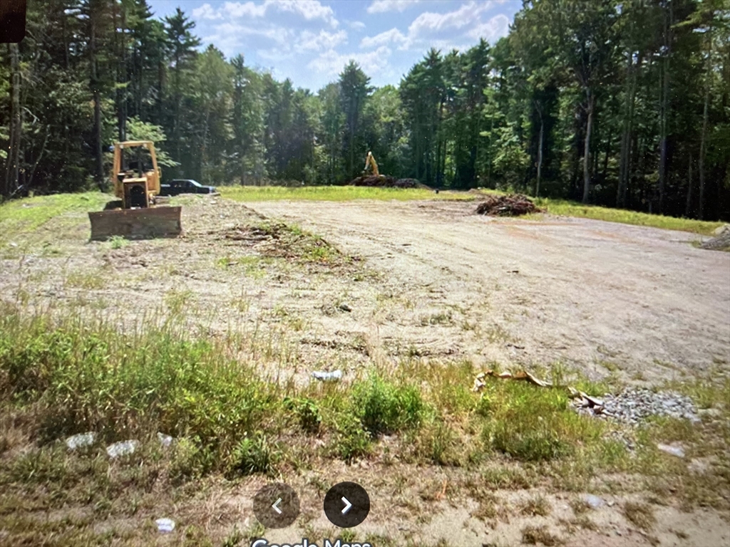 a view of a backyard of the house