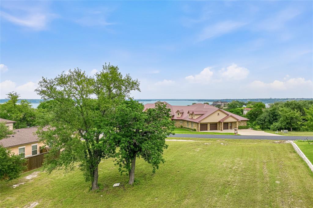 4512 Blue Ridge Drive Belton, TX 76513 - Photo 3 of 12 a view of swimming pool with lawn chairs and large trees
