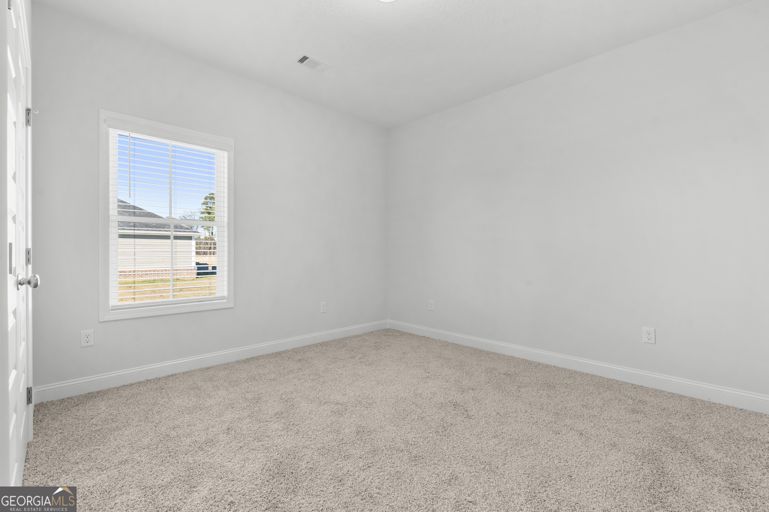 209 Hopecrest Road Statesboro, GA 30458 - Photo 19 of 27 an empty room with a window