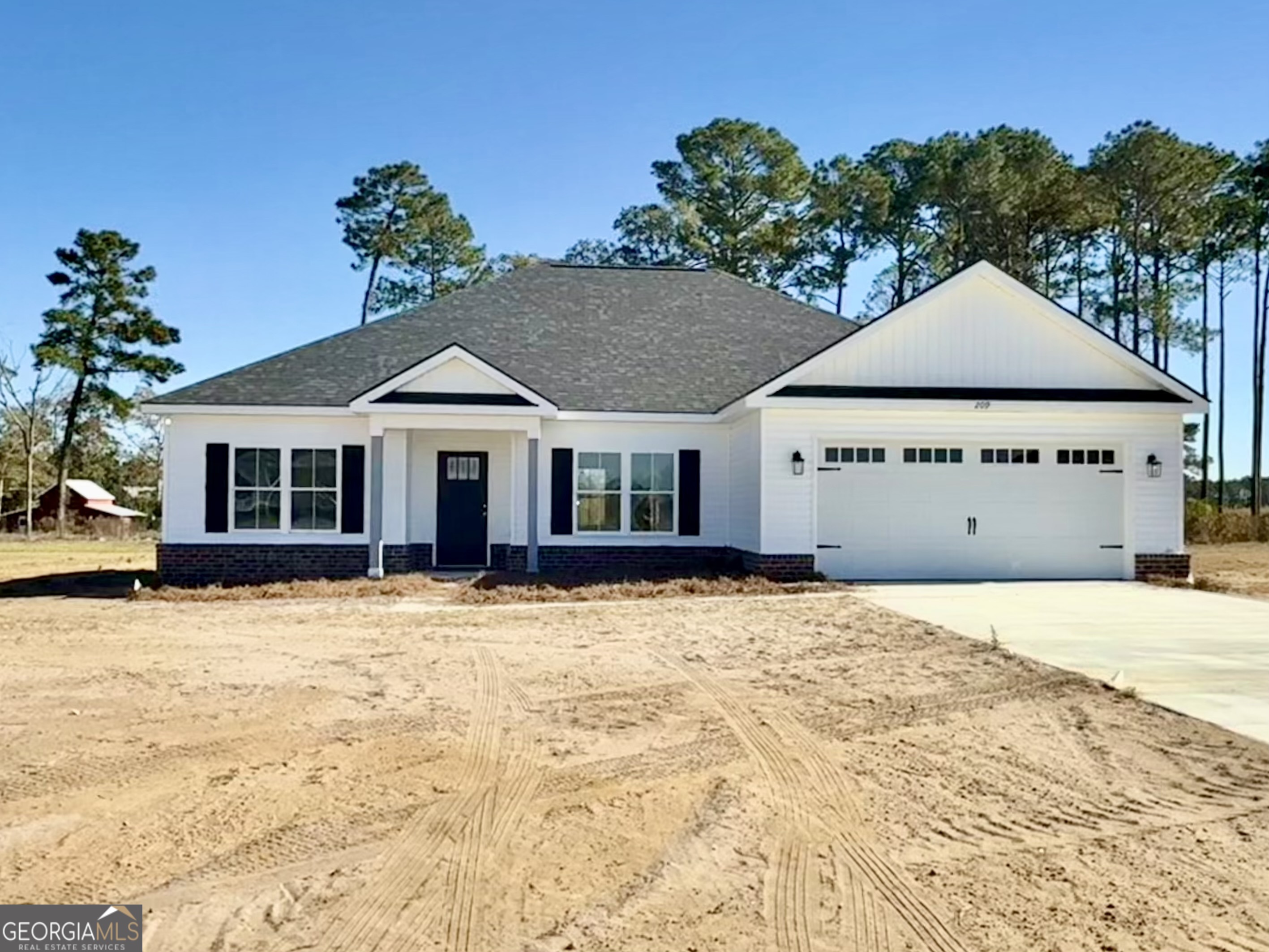 209 Hopecrest Road Statesboro, GA 30458 - Photo 24 of 27 a front view of a house with a yard
