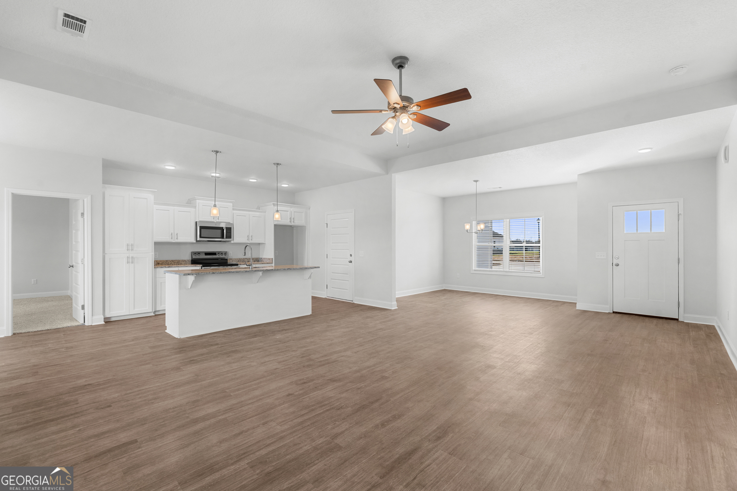 209 Hopecrest Road Statesboro, GA 30458 - Photo 7 of 27 a view of kitchen with kitchen island stainless steel appliances sink and microwave