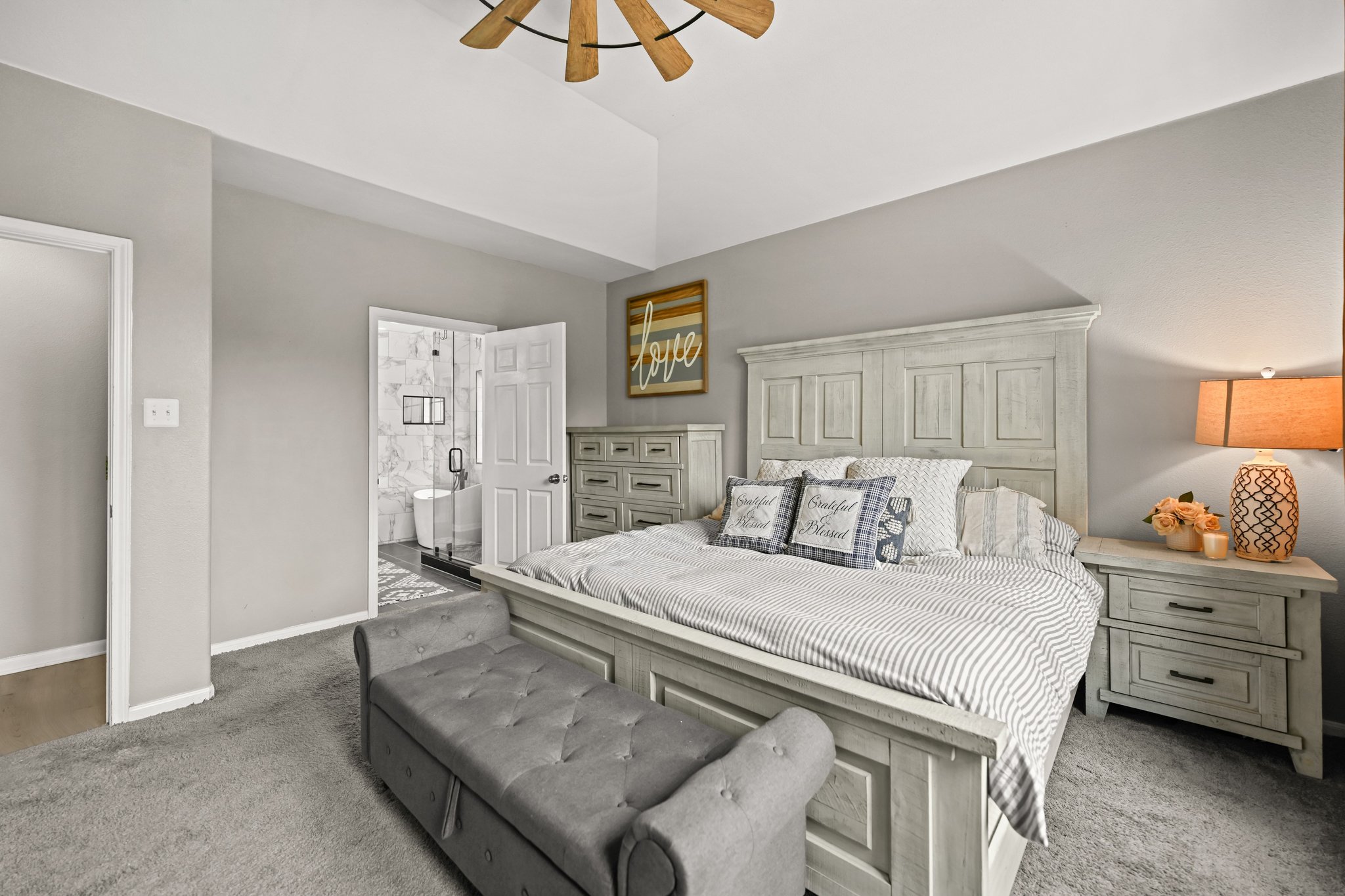 5528 Wild Foxglove Road Spicewood, TX 78669 - Photo 13 of 38 Spacious room featuring vaulted ceilings, light gray wall paint, and gray carpet flooring