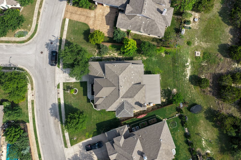 5528 Wild Foxglove Road Spicewood, TX 78669 - Photo 36 of 38 Aerial view showcasing the expansive property with a multi-gabled roofline