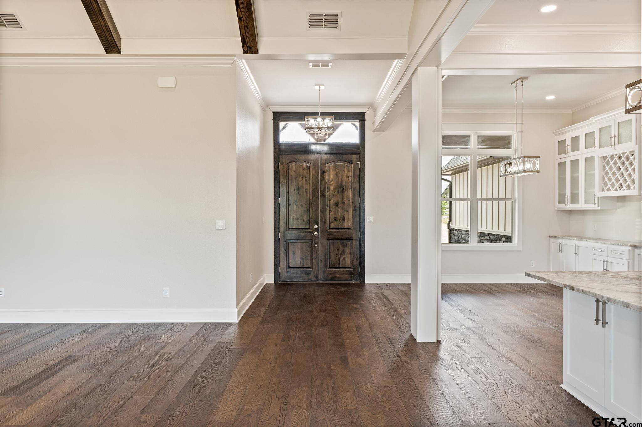 21064 Woodring Road Bullard, TX 75757 - Photo 17 of 48 a view of hallway with wooden floor