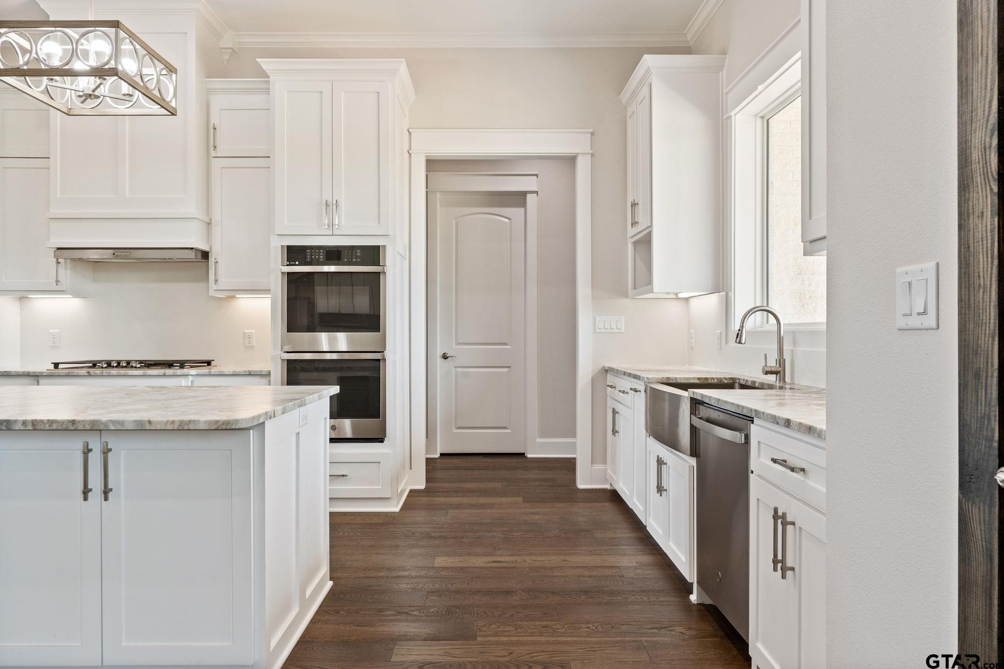 21064 Woodring Road Bullard, TX 75757 - Photo 20 of 48 a kitchen with stainless steel appliances granite countertop a stove and a refrigerator