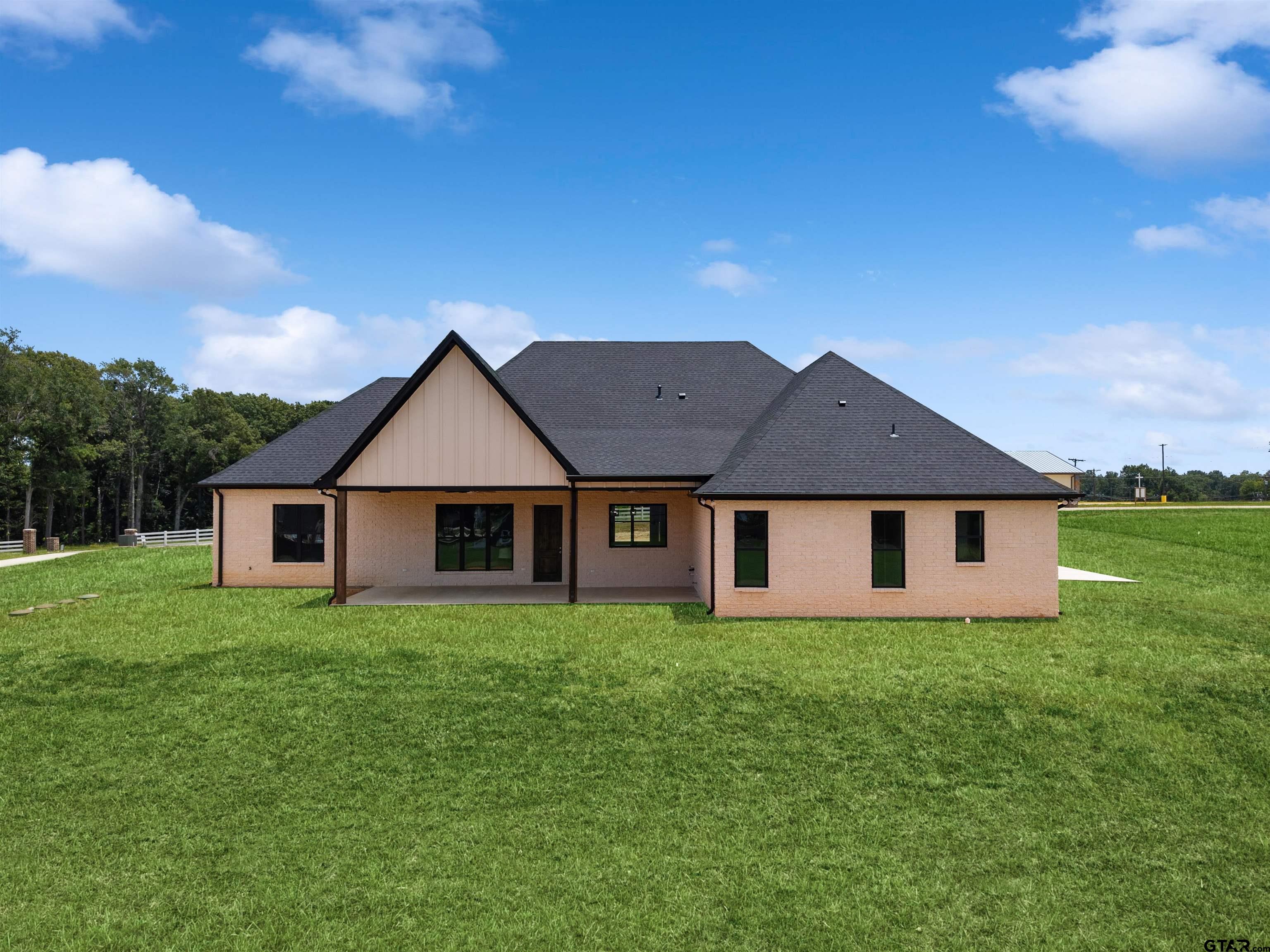 21064 Woodring Road Bullard, TX 75757 - Photo 2 of 48 front view of house with a yard