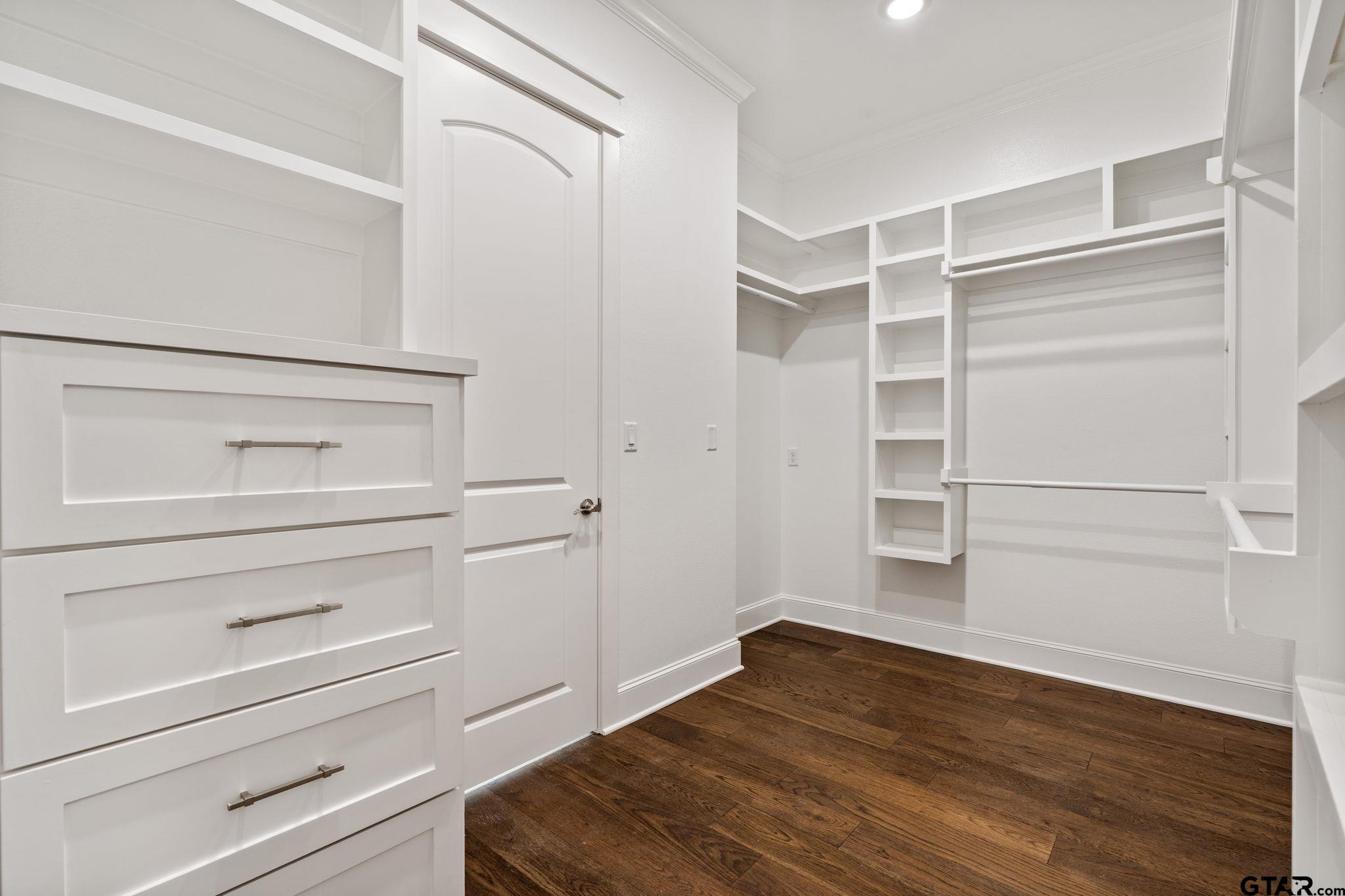 21064 Woodring Road Bullard, TX 75757 - Photo 42 of 48 a view of walk in closet with empty racks