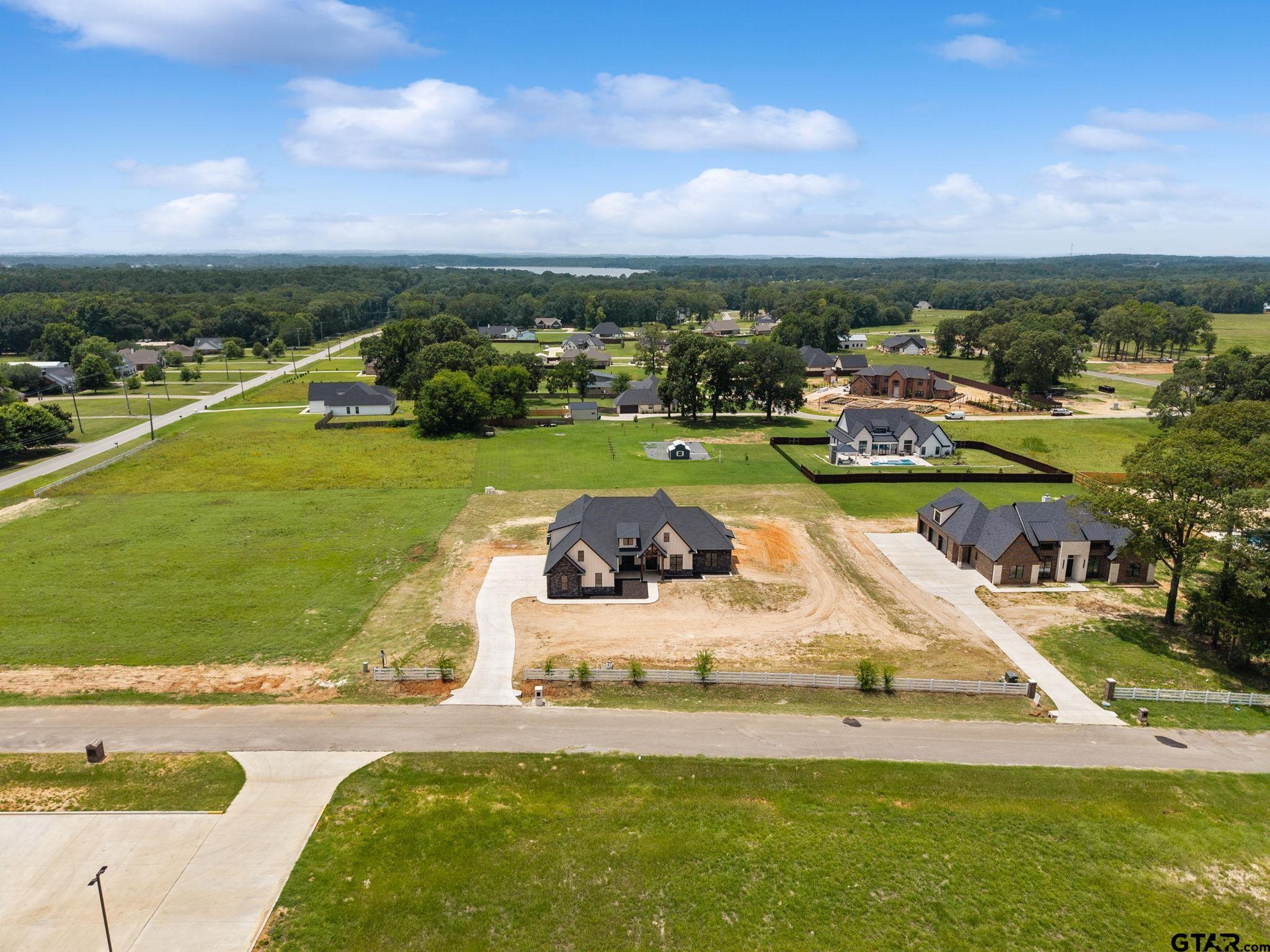 21064 Woodring Road Bullard, TX 75757 - Photo 5 of 48 a view of a swimming pool and lake view