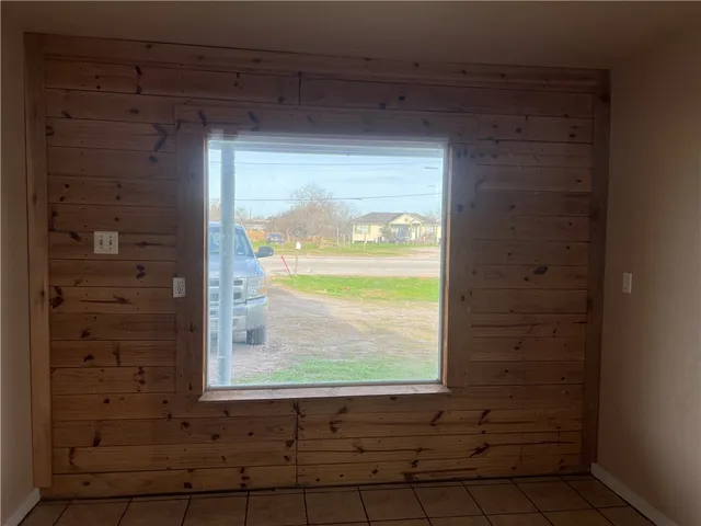 a view of an empty room and window