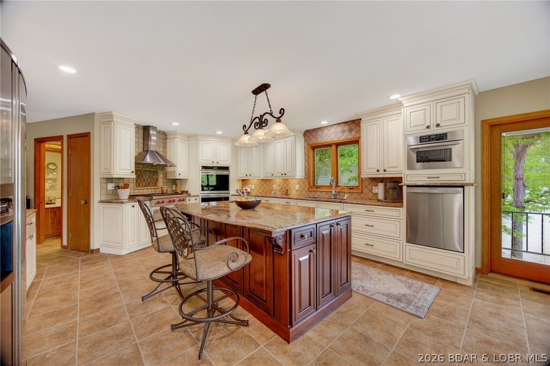 2293 Standing Rock Road Camdenton, MO 65020 - Photo 33 of 99 What an Inviting Kitchen Island at which the Cook