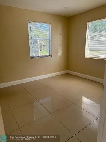 a view of a hallway with bathroom