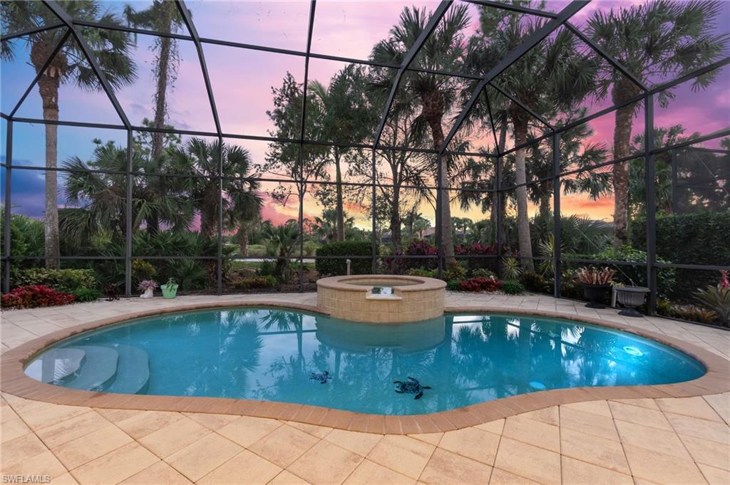 a view of a swimming pool with a patio