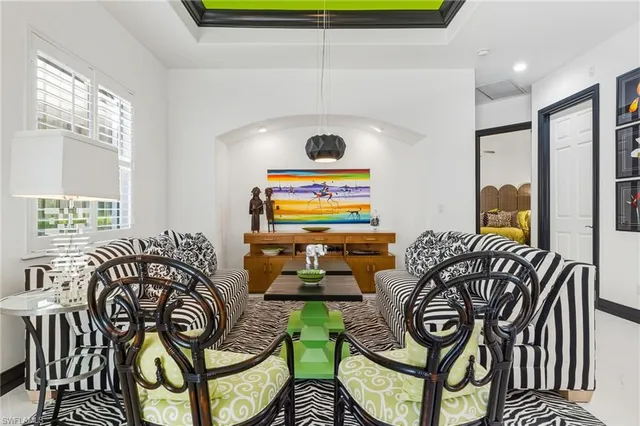 a bedroom with furniture and a window