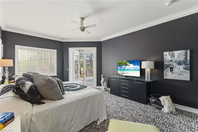 a bedroom with a bed furniture and windows