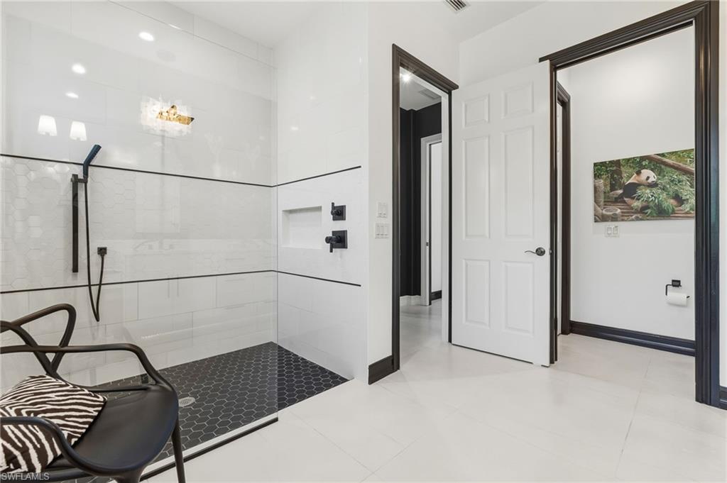 19979 Markward Crossing Estero, FL 33928 - Photo 18 of 36 a bathroom with a sink and a shower