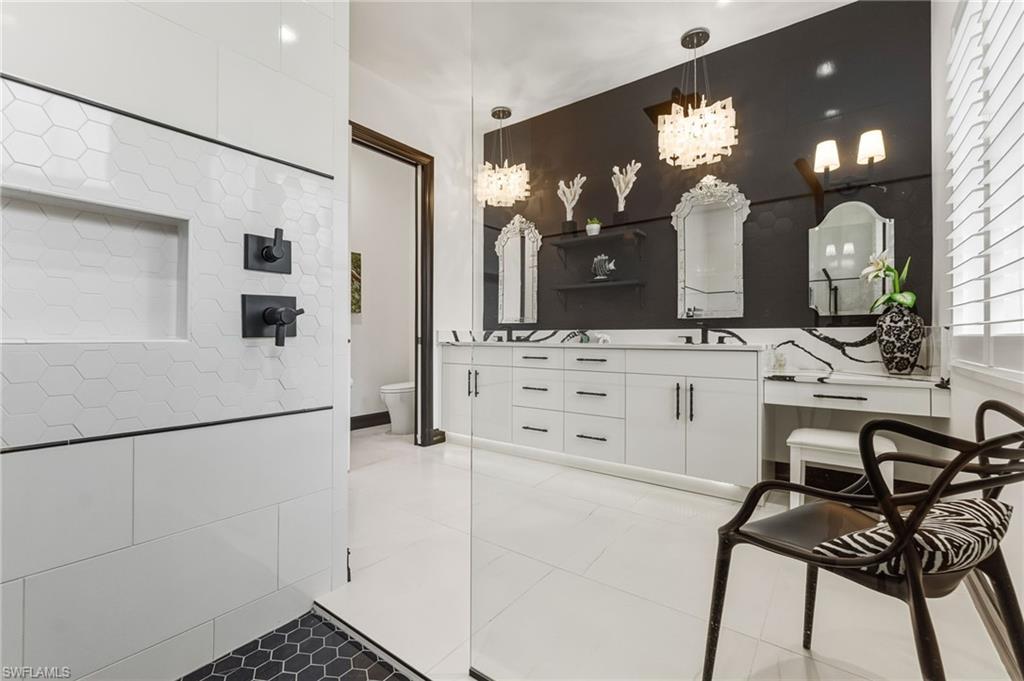 19979 Markward Crossing Estero, FL 33928 - Photo 19 of 36 a view of a hallway that has a dining table and chairs