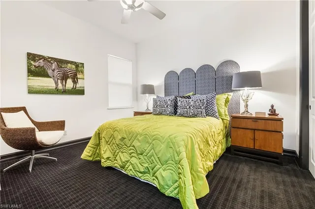 a bedroom with a bed and a chair