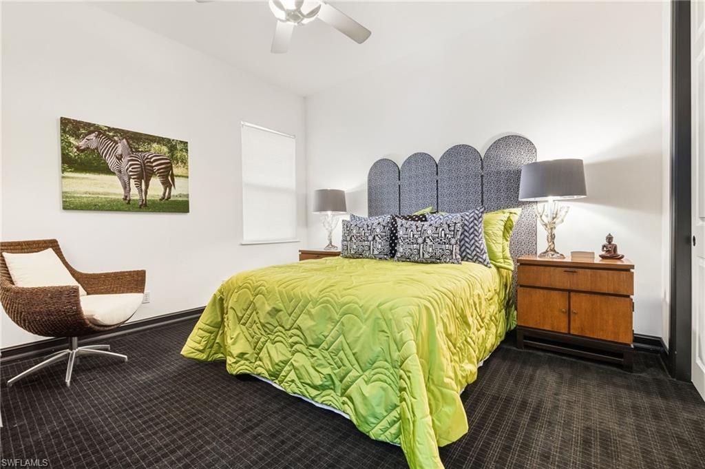 19979 Markward Crossing Estero, FL 33928 - Photo 20 of 36 a bedroom with a bed and a chair