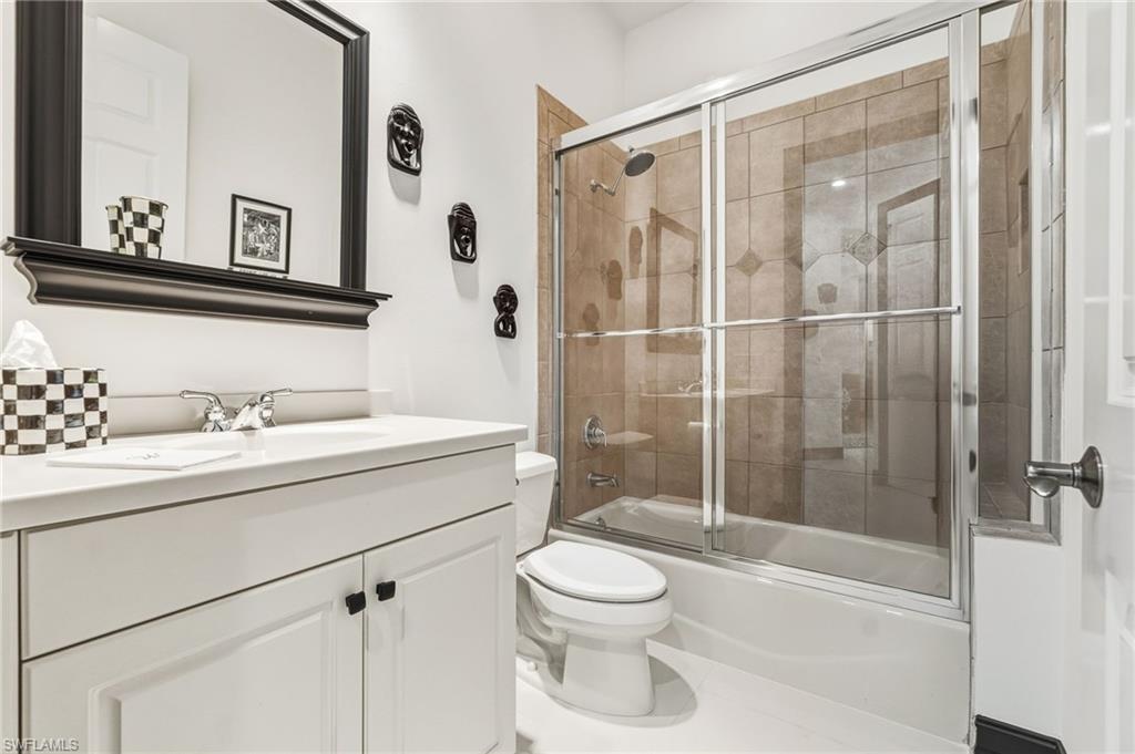 19979 Markward Crossing Estero, FL 33928 - Photo 21 of 36 a bathroom with a sink a toilet and shower