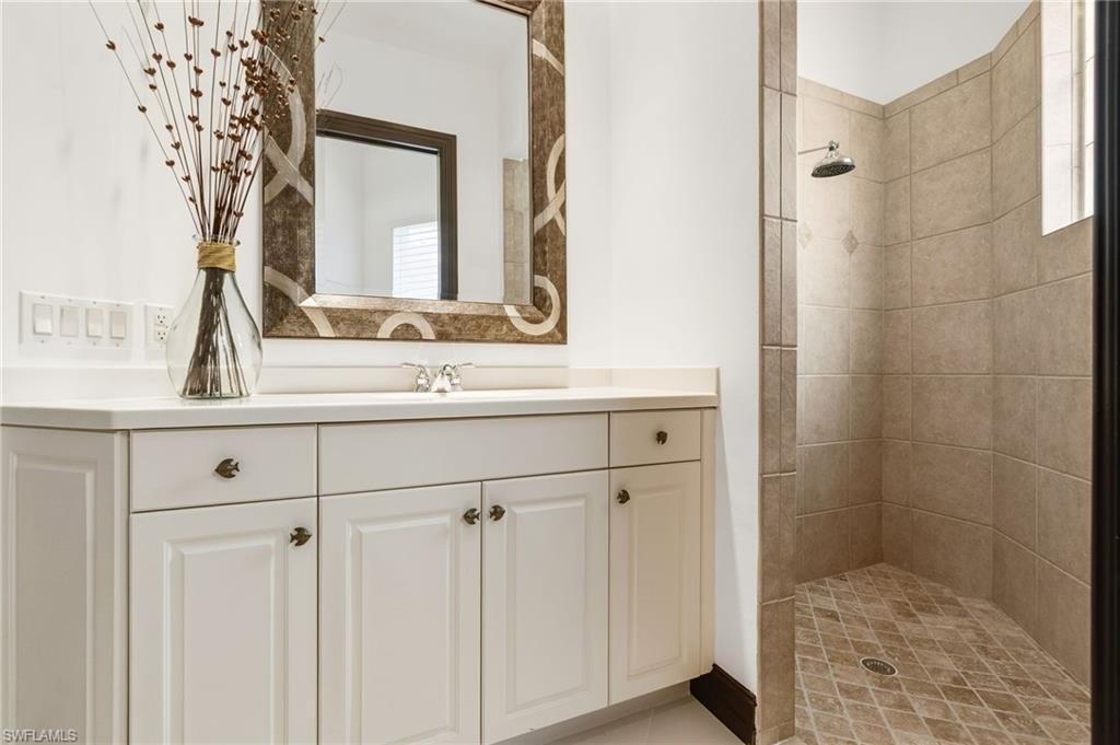 19979 Markward Crossing Estero, FL 33928 - Photo 23 of 36 a bathroom with a sink and a mirror