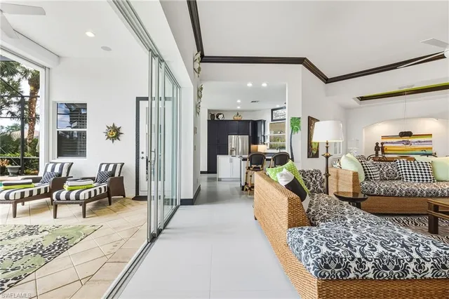 a living room with furniture tv and a table