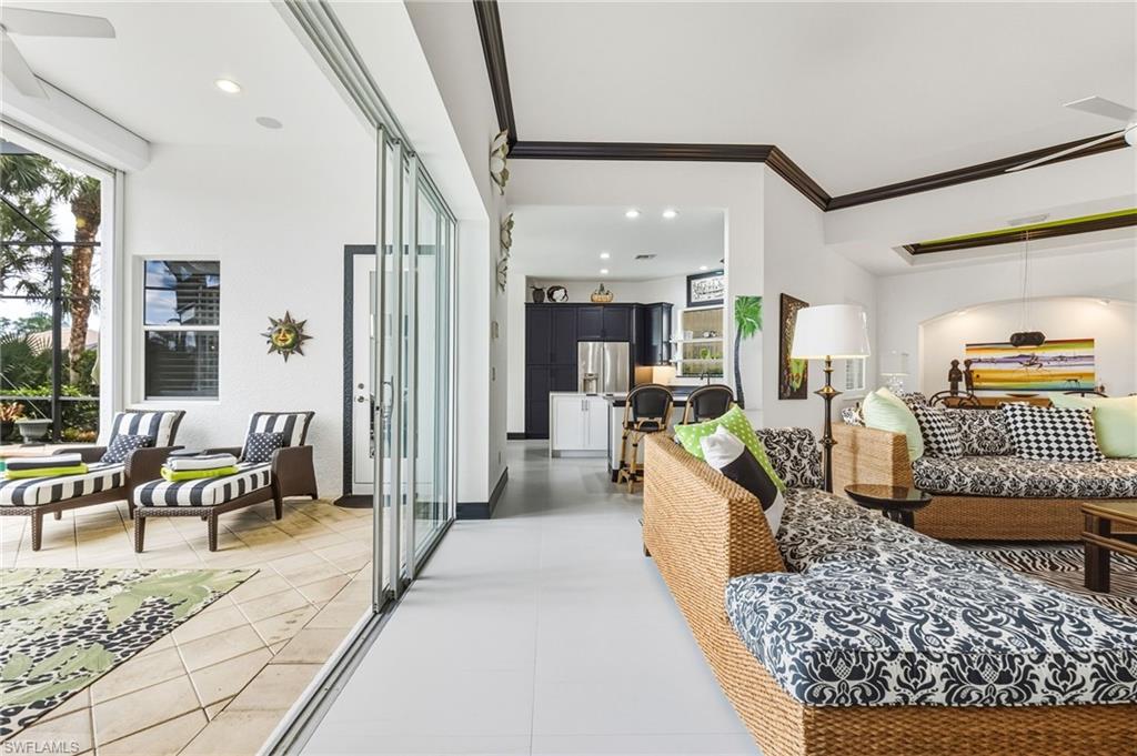 19979 Markward Crossing Estero, FL 33928 - Photo 25 of 36 a living room with furniture tv and a table