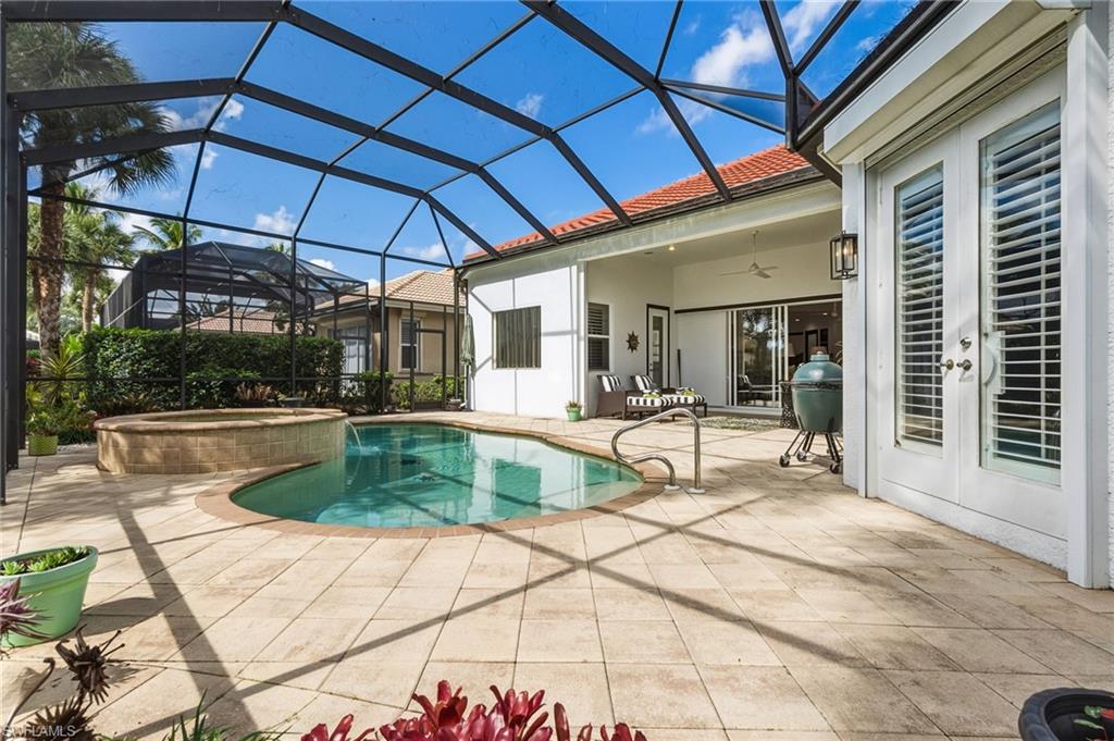 19979 Markward Crossing Estero, FL 33928 - Photo 27 of 36 a view of a backyard with a patio and fire pit