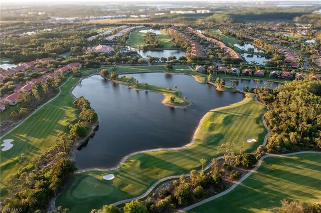 an aerial view of lake and city