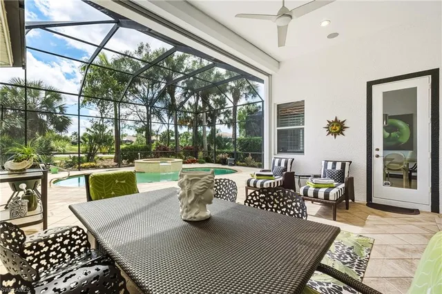 a view of a patio with couches table and chairs and potted plants