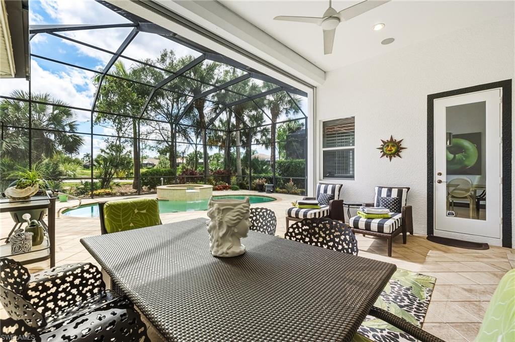 19979 Markward Crossing Estero, FL 33928 - Photo 4 of 36 a view of a patio with couches table and chairs and potted plants
