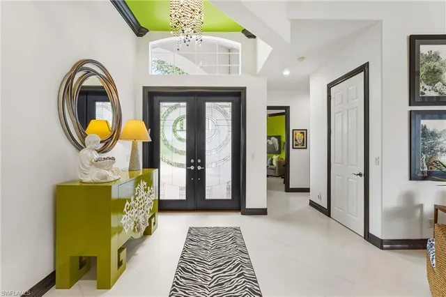 a bedroom with a bed and a mirror