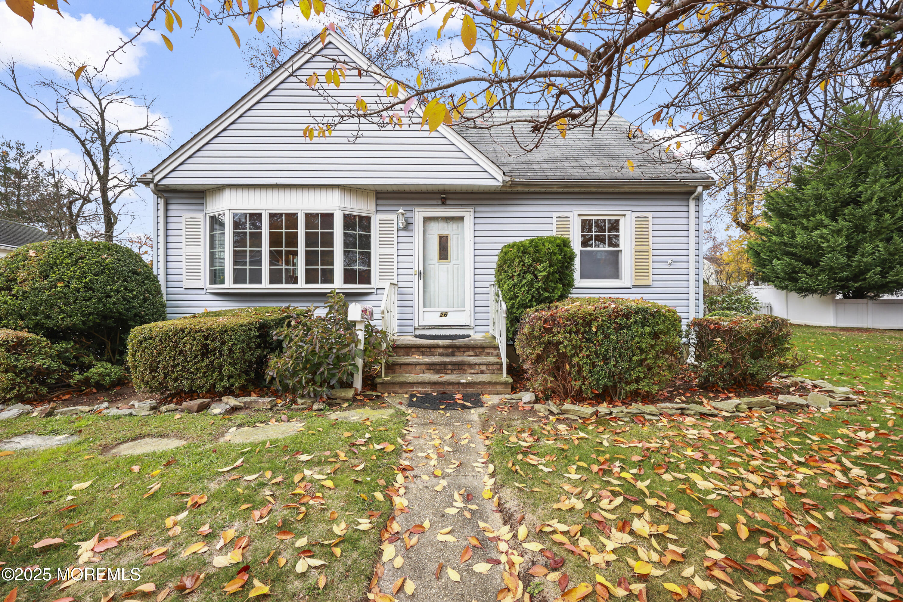 a view of a house with next to a yard