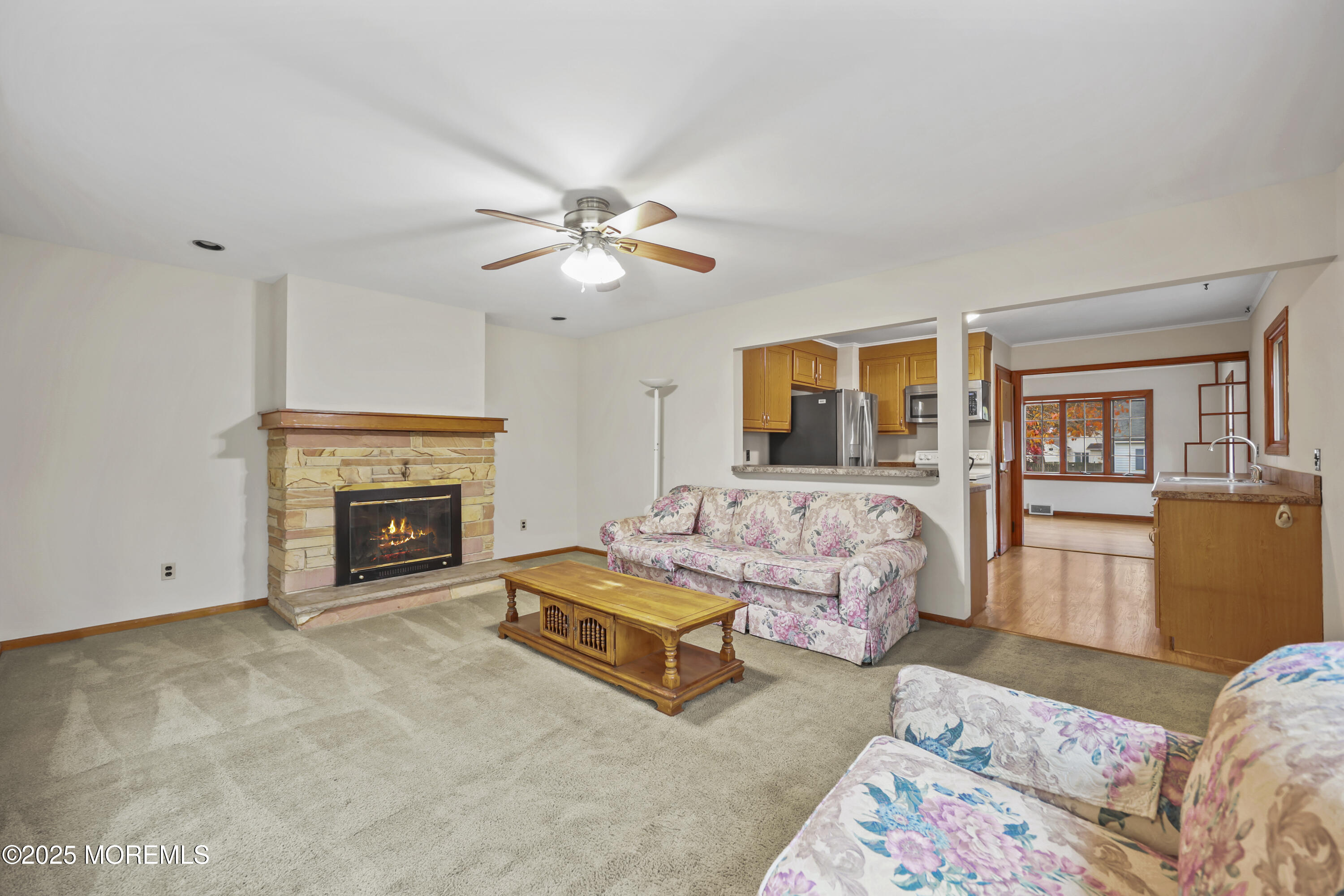 26 Edgewater Drive Matawan, NJ 07747 - Photo 17 of 23 a living room with furniture and a fireplace