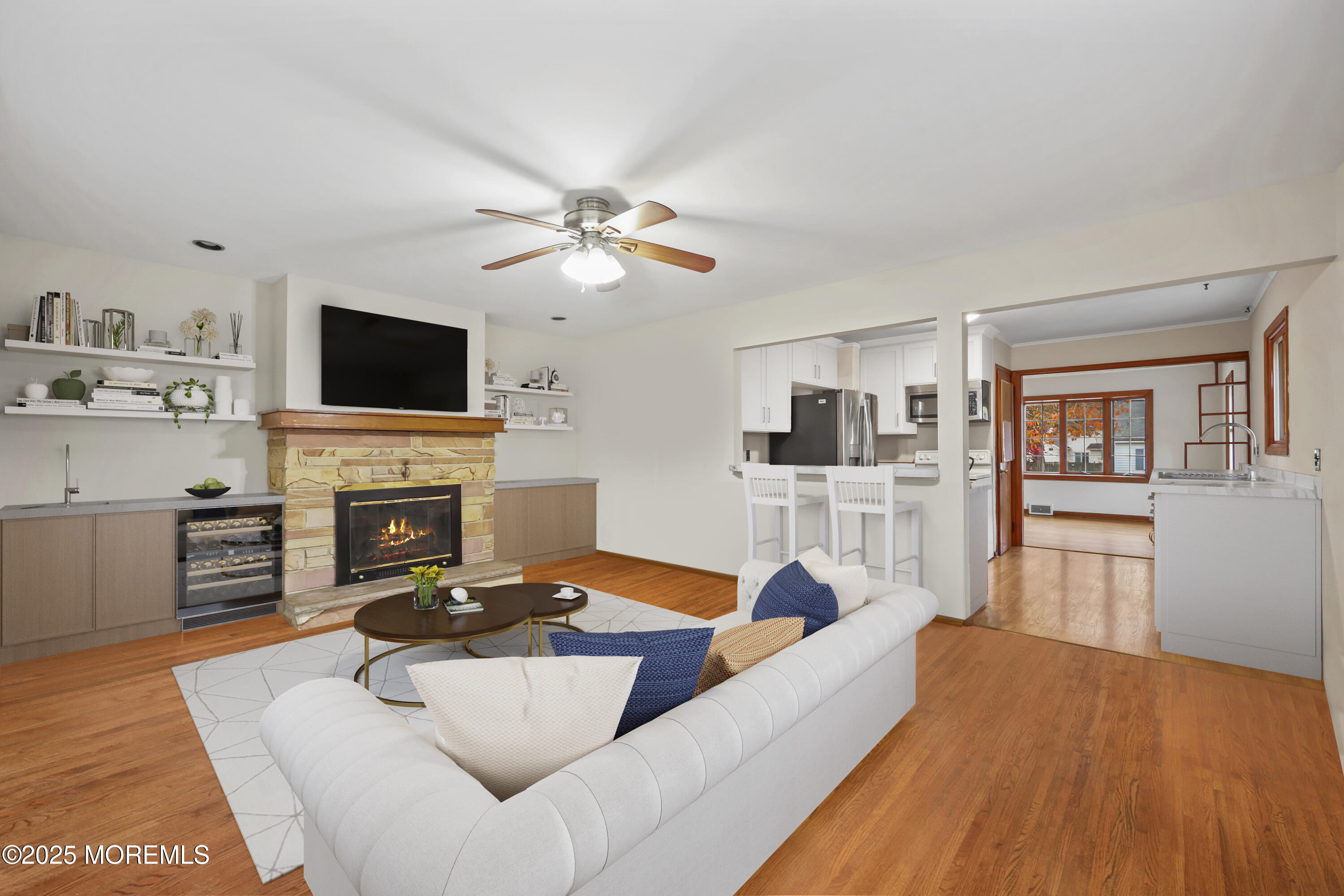 26 Edgewater Drive Matawan, NJ 07747 - Photo 18 of 23 a living room with furniture a fireplace and a flat screen tv