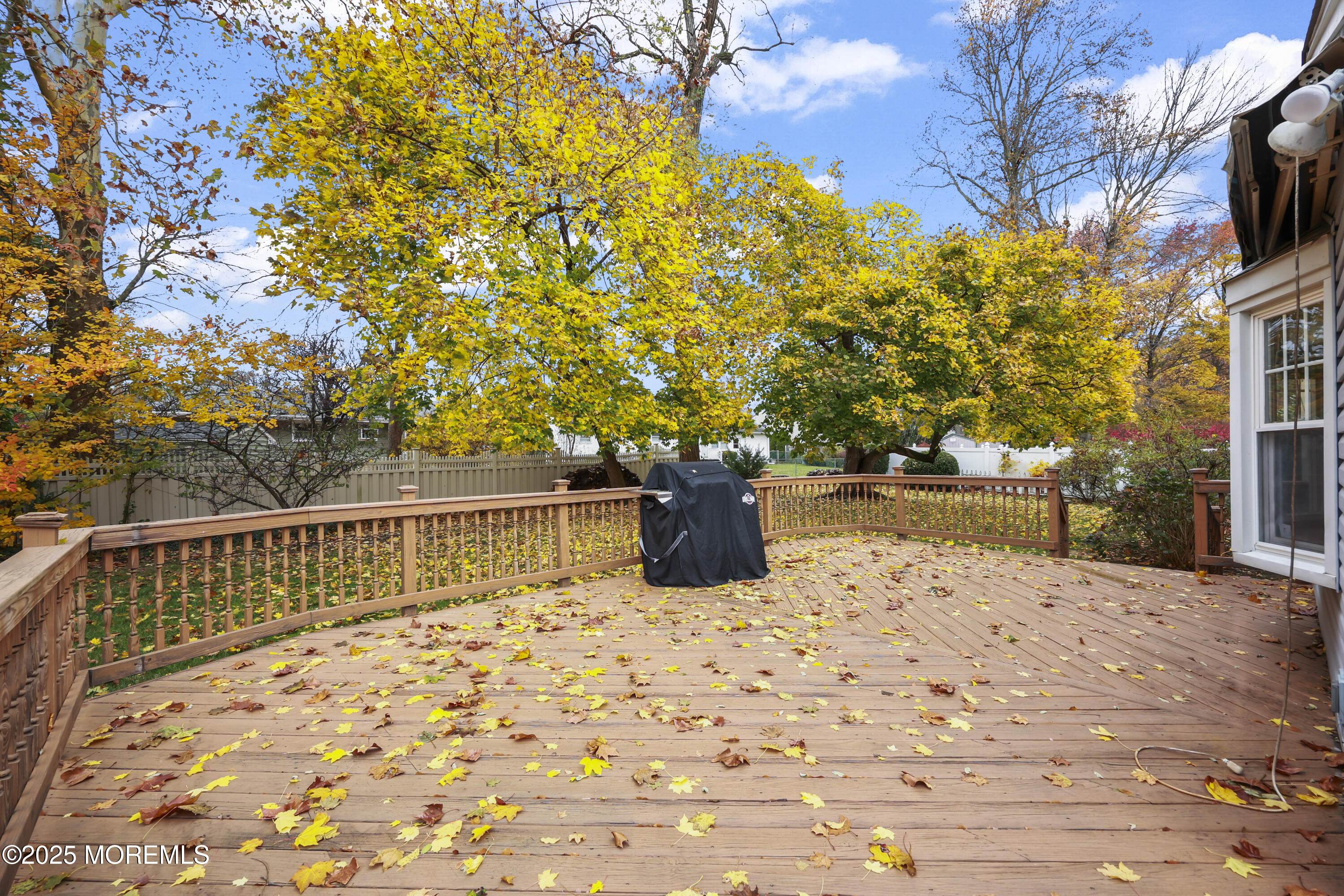26 Edgewater Drive Matawan, NJ 07747 - Photo 5 of 23 a view of roof deck with wooden fence and floor