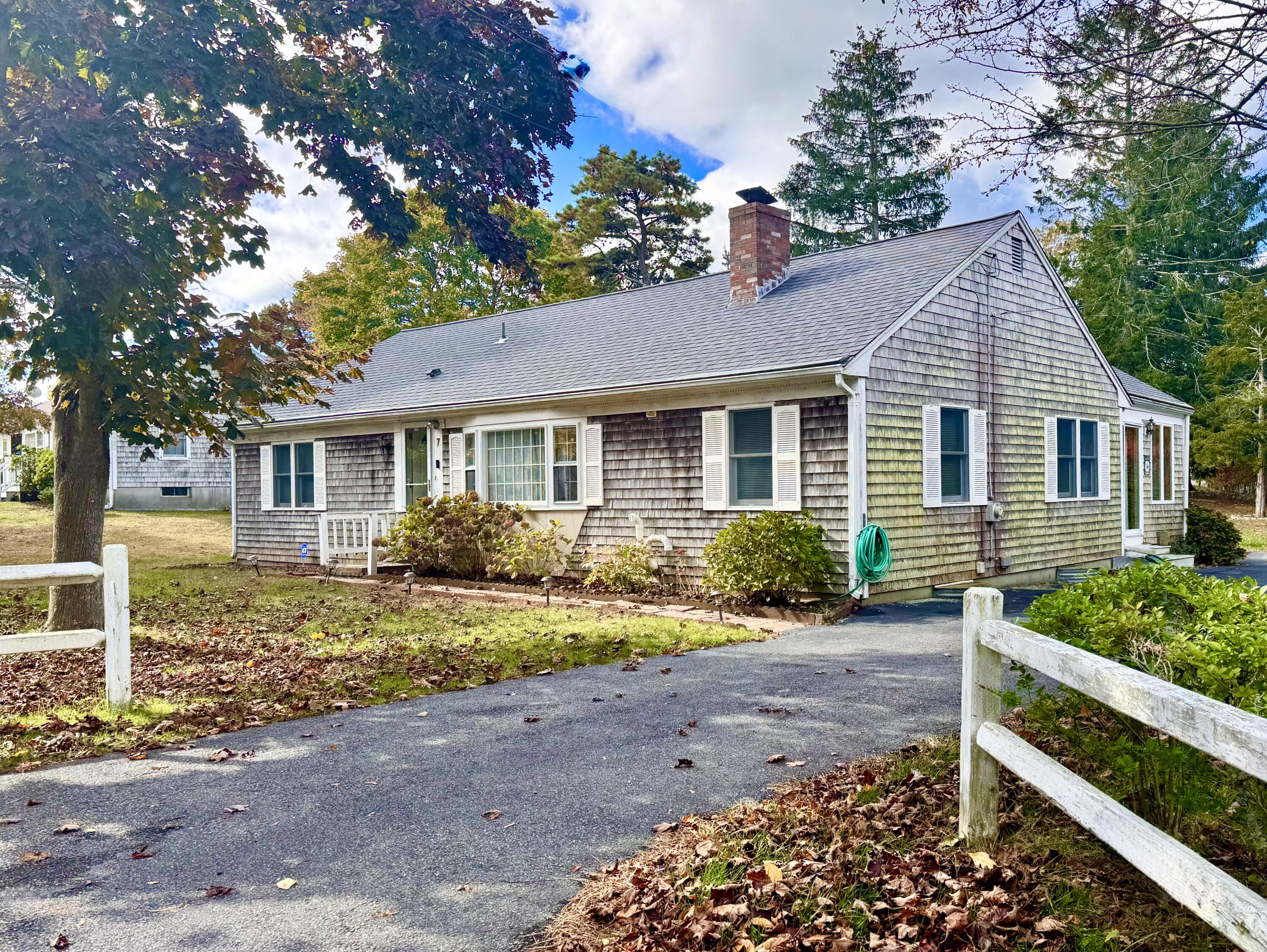 7 Delta Street Hyannis, MA 02601 - Photo 3 of 29 a front view of a house with a yard and outdoor seating