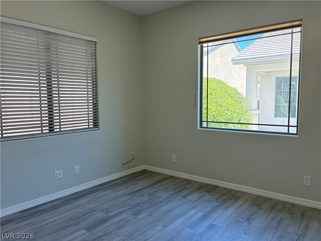 10 Caprington Road Henderson, NV 89052 - Photo 36 of 44 An airy interior space featuring abundant natural light and durable wood flooring.